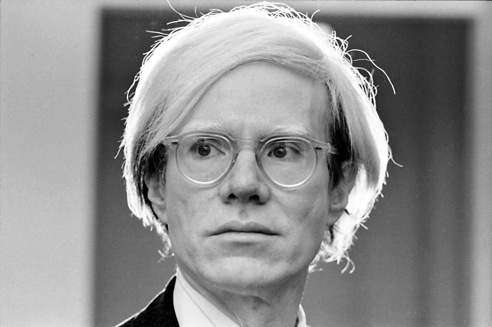 Andy Warhol wearing glasses