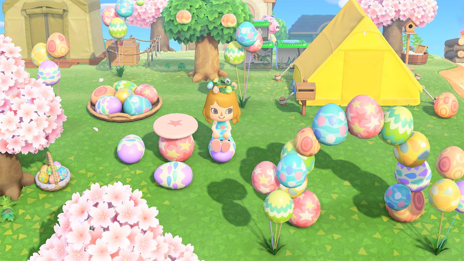 An Animal Crossing: New Horizons villager sits among Bunny Day eggs and egg furniture.
