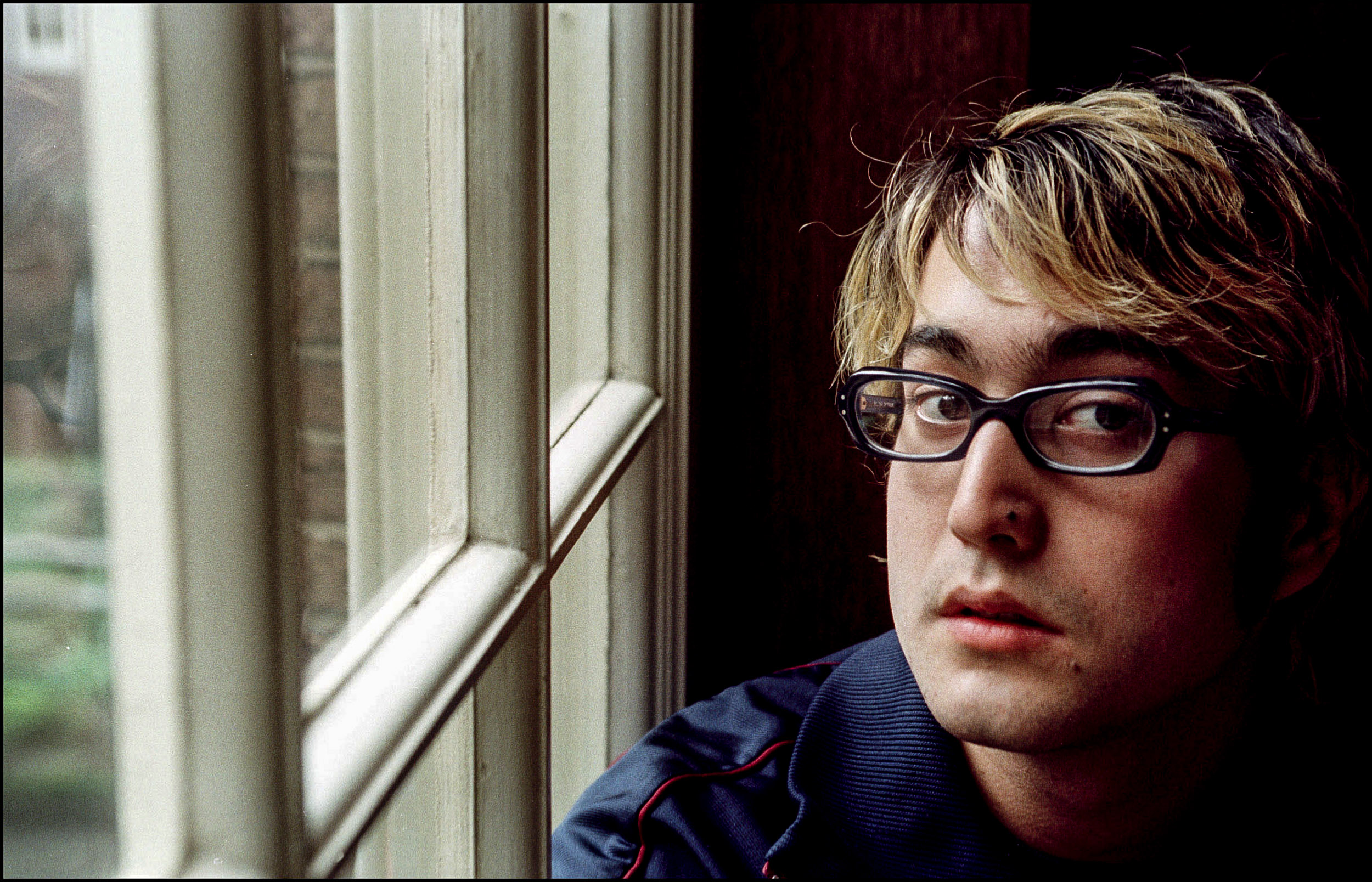 John Lennon's son, Sean Lennon, near a window
