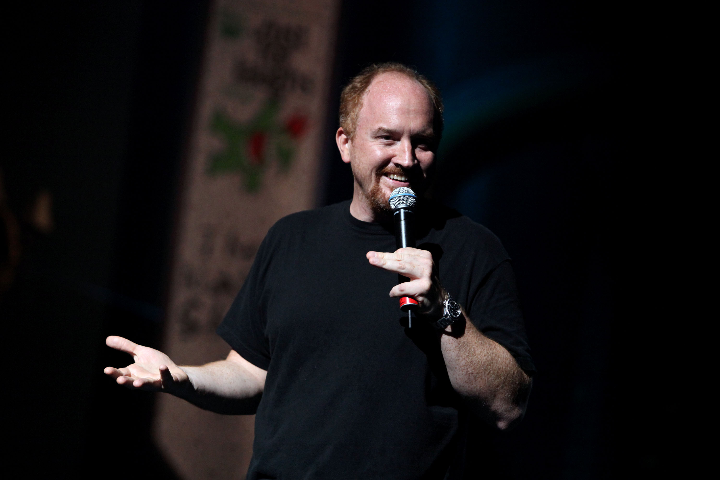 Louis C.K. peforms on stage in 2009