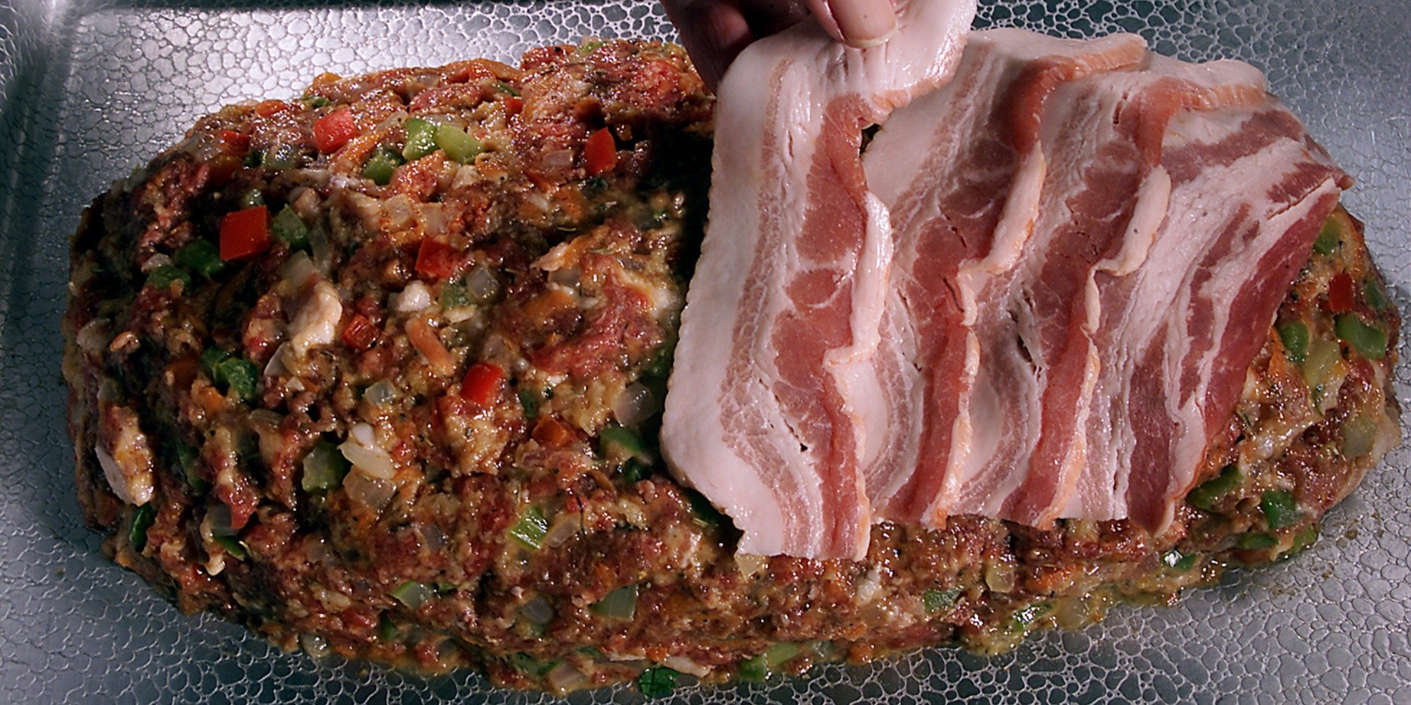 Meatloaf covered in bacon.