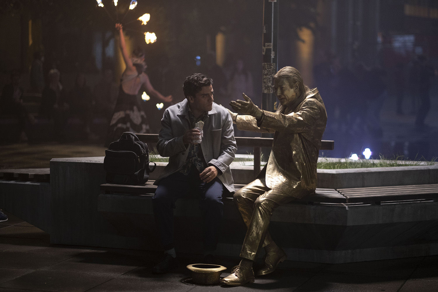 Oscar Isaac as Steven Grant and Shaun Scott as Crawley in Moon Knight Episode 1, discussing Steven's date at a steak house