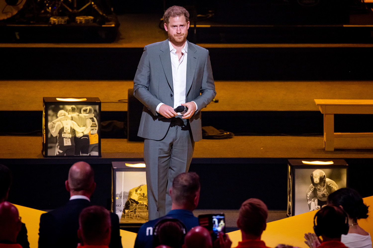 Prince Harry wears a gray shirt and looks emotional at the 2022 Invictus Games opening ceremony