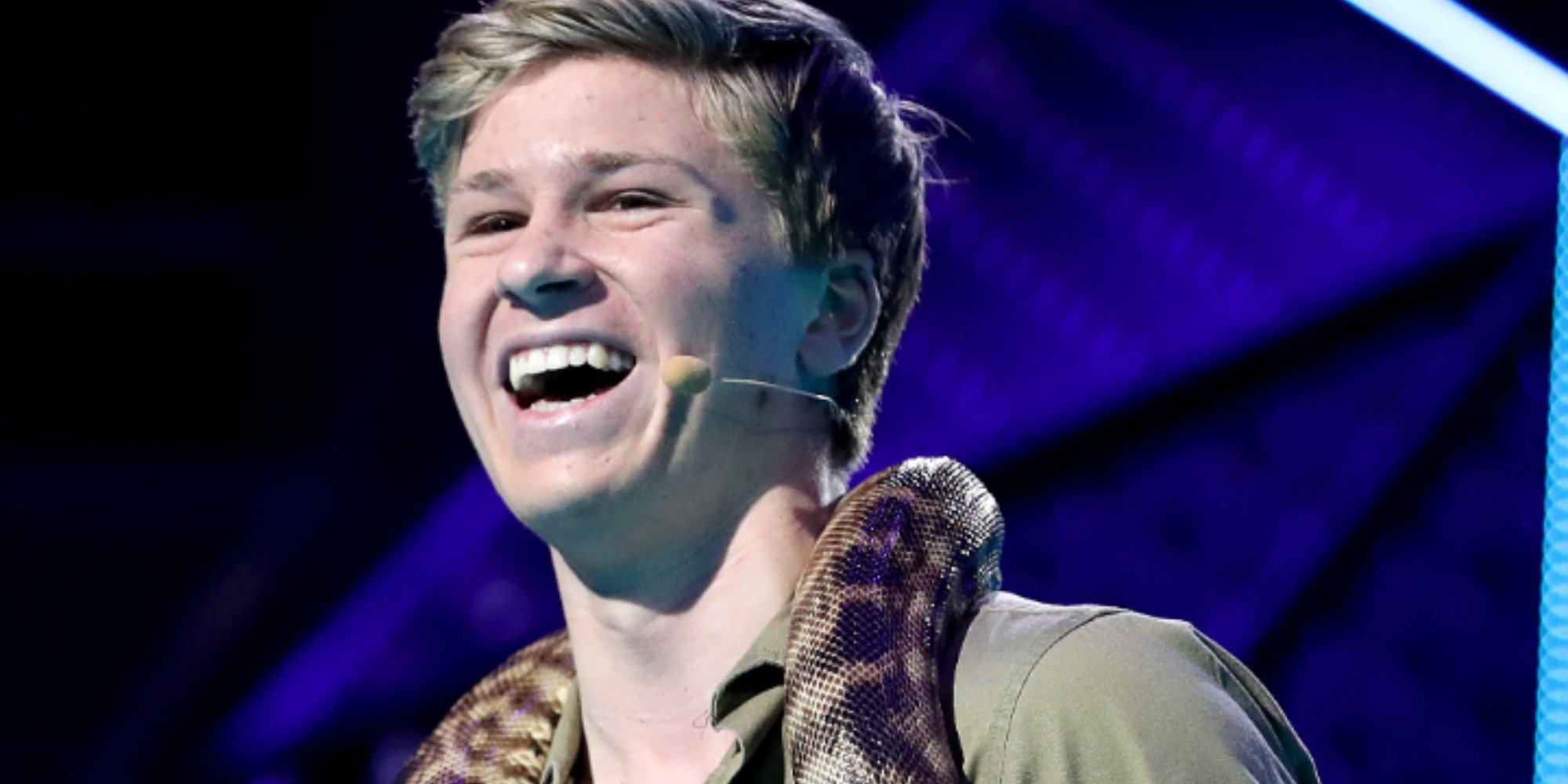 Robert Irwin poses with a snake around his neck.