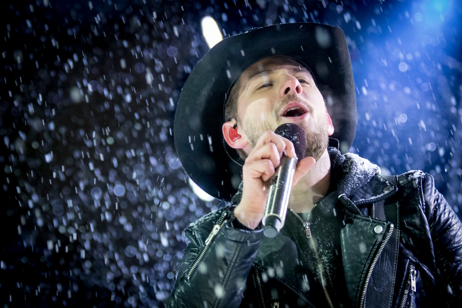 Brett Kissel, singer of 'Ain't The Same' performing on stage.