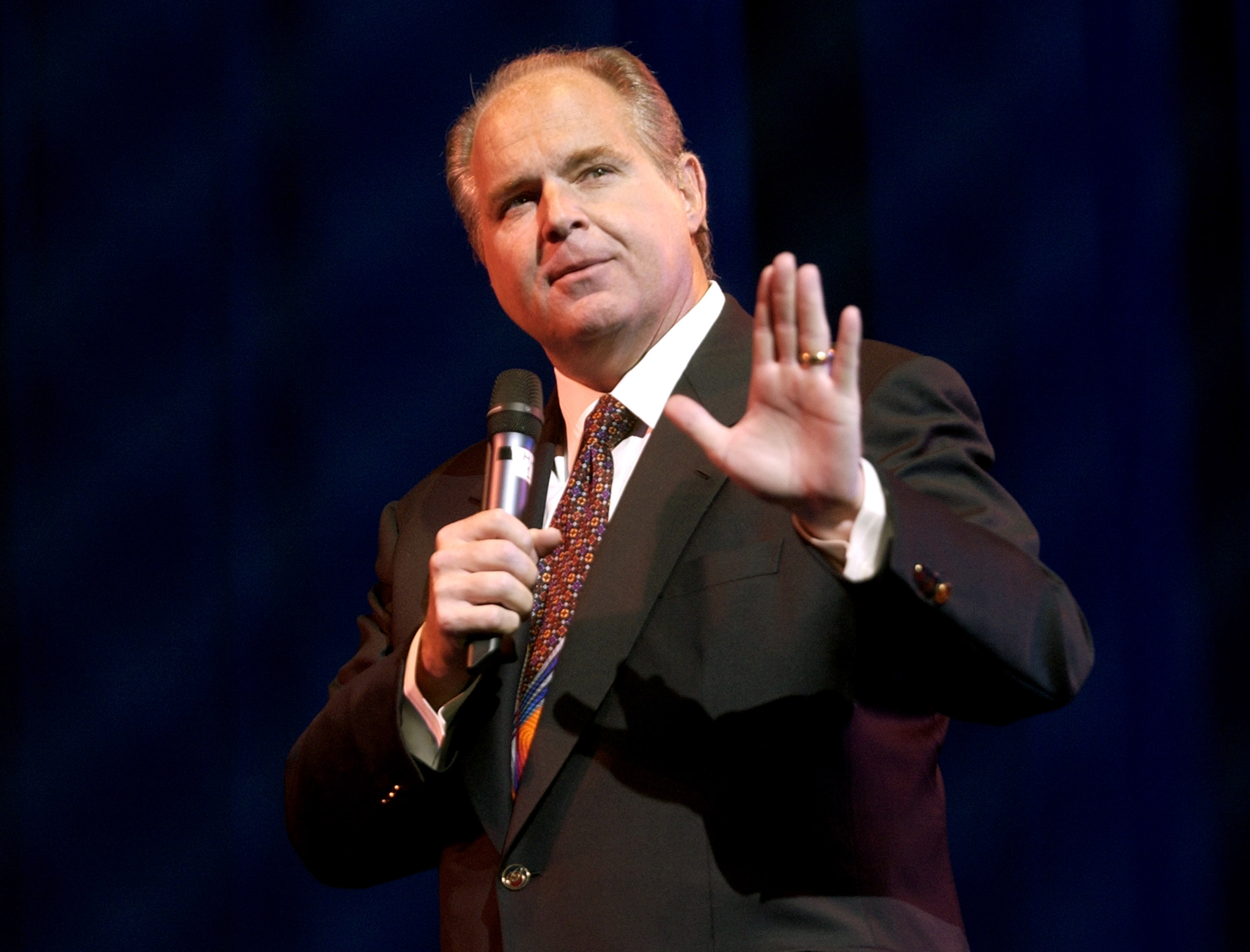 Rush Limbaugh with a microphone