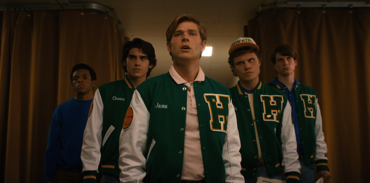 'Stranger Things' Season 4 show several boys with high school letterman jackets.