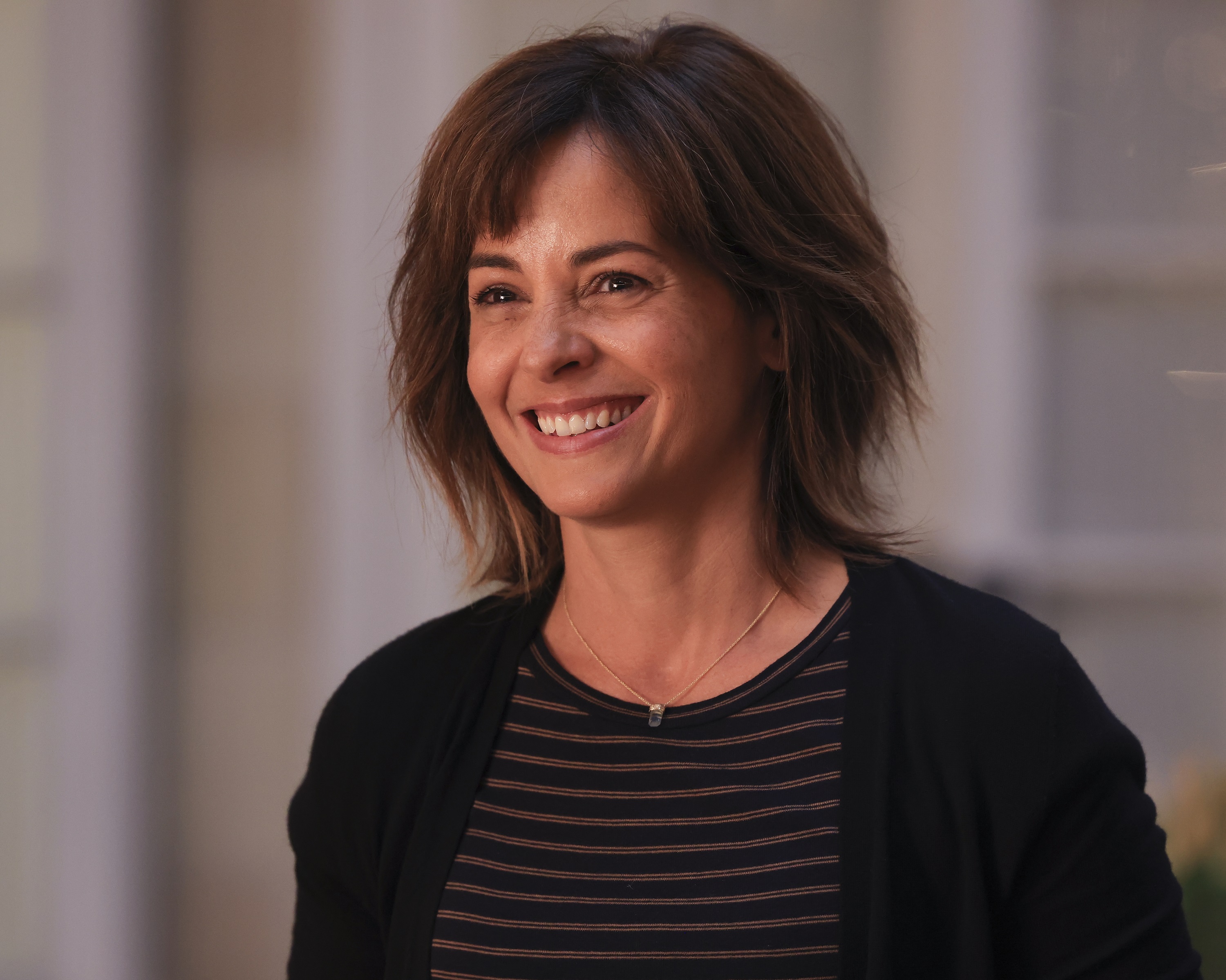 Stephanie Szostak smiles as Delilah in 'A Million Little Things'