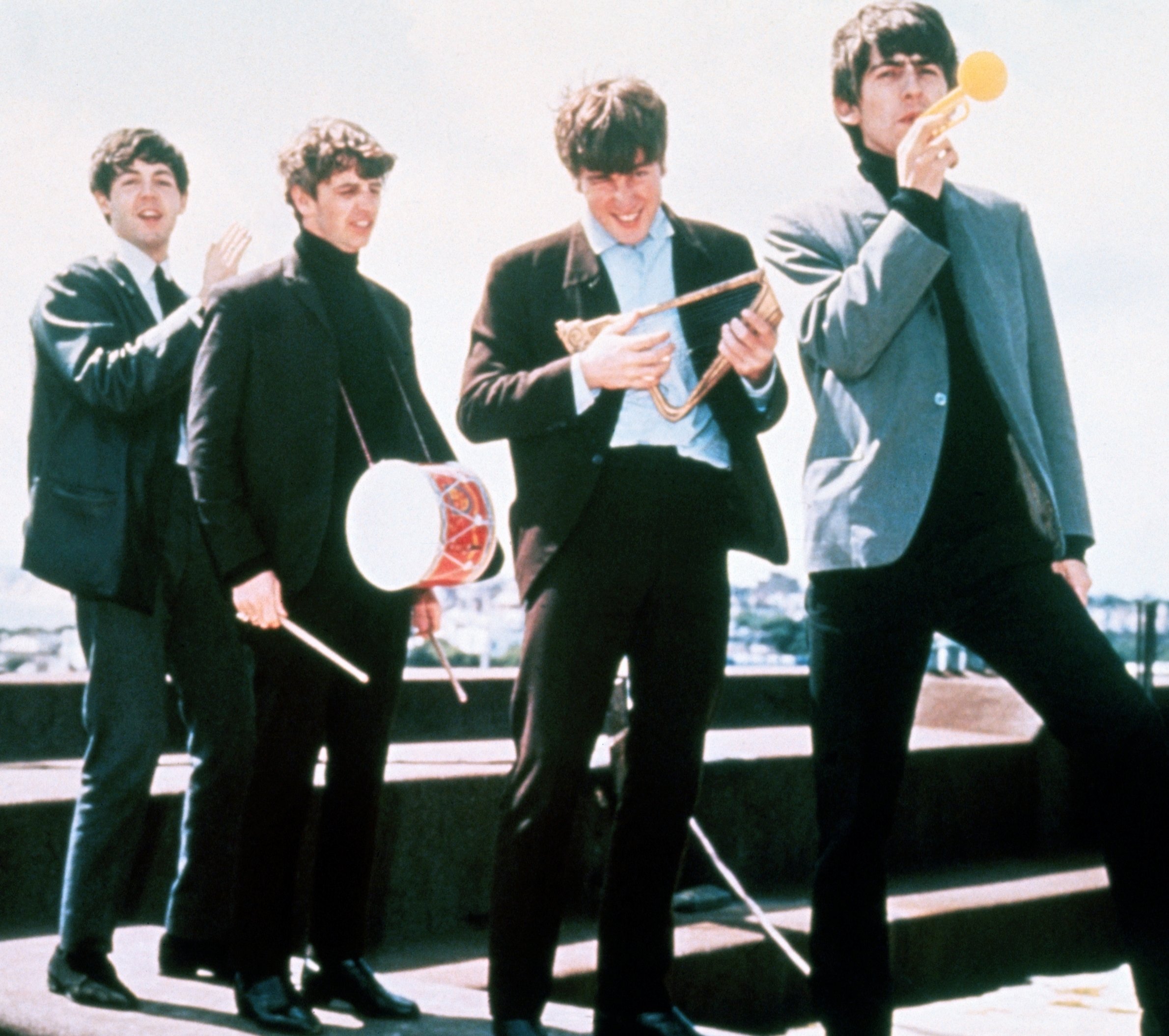 The Beatles' Paul McCartney, Ringo Starr, John Lennon, and George Harrison wearing suits