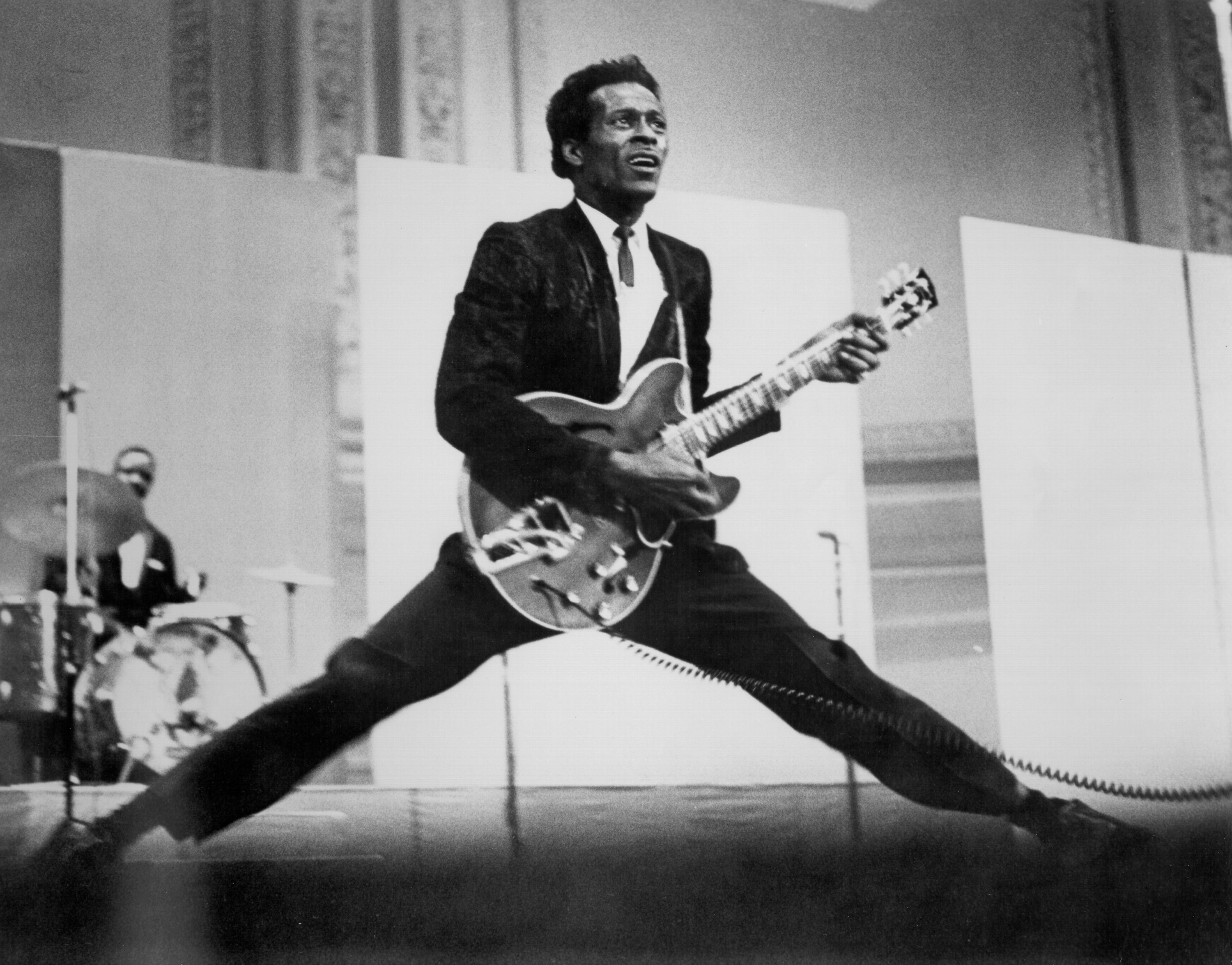 Chuck Berry playing songs on his guitar