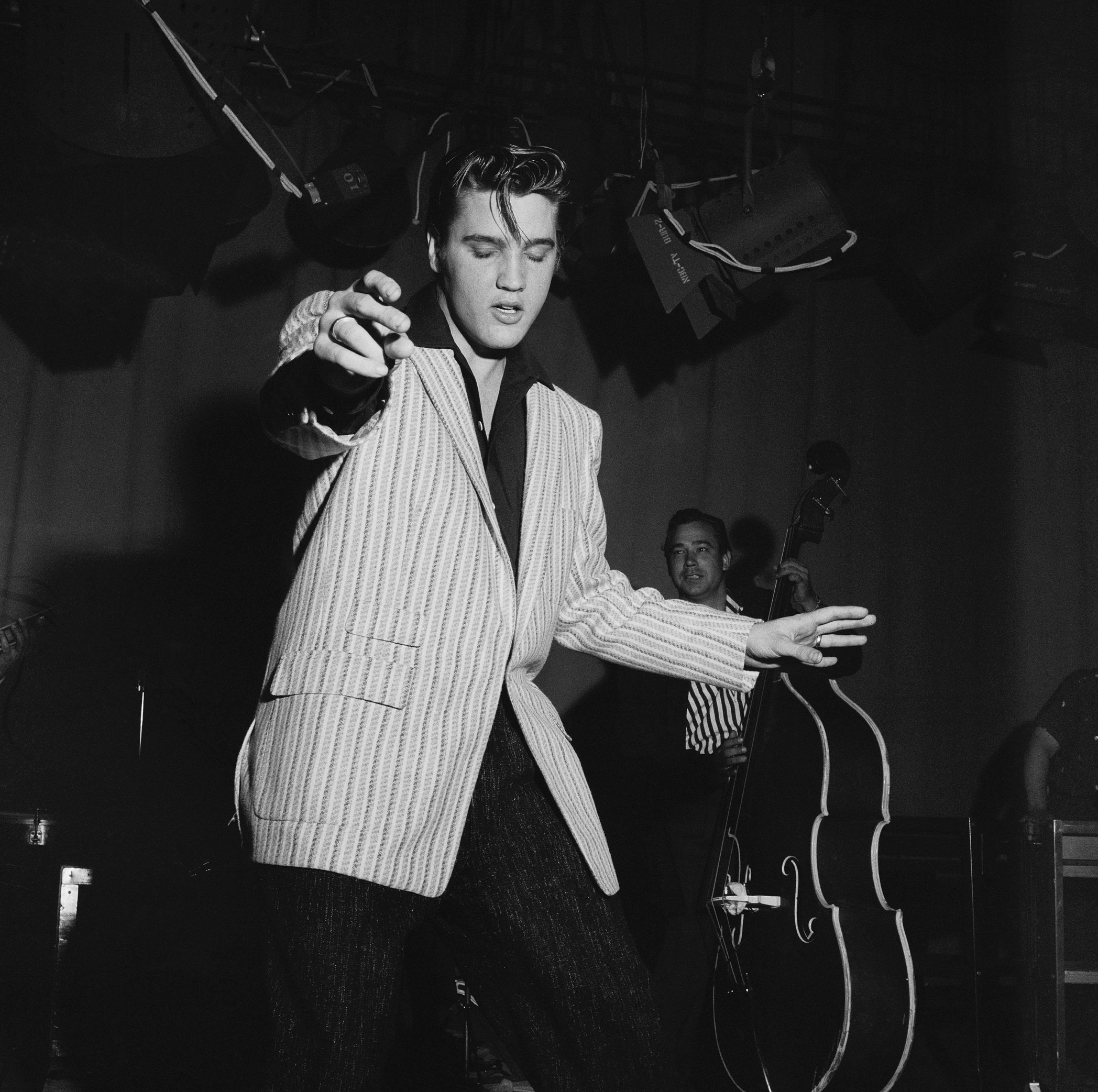 Elvis Presley singing songs while moving his hips