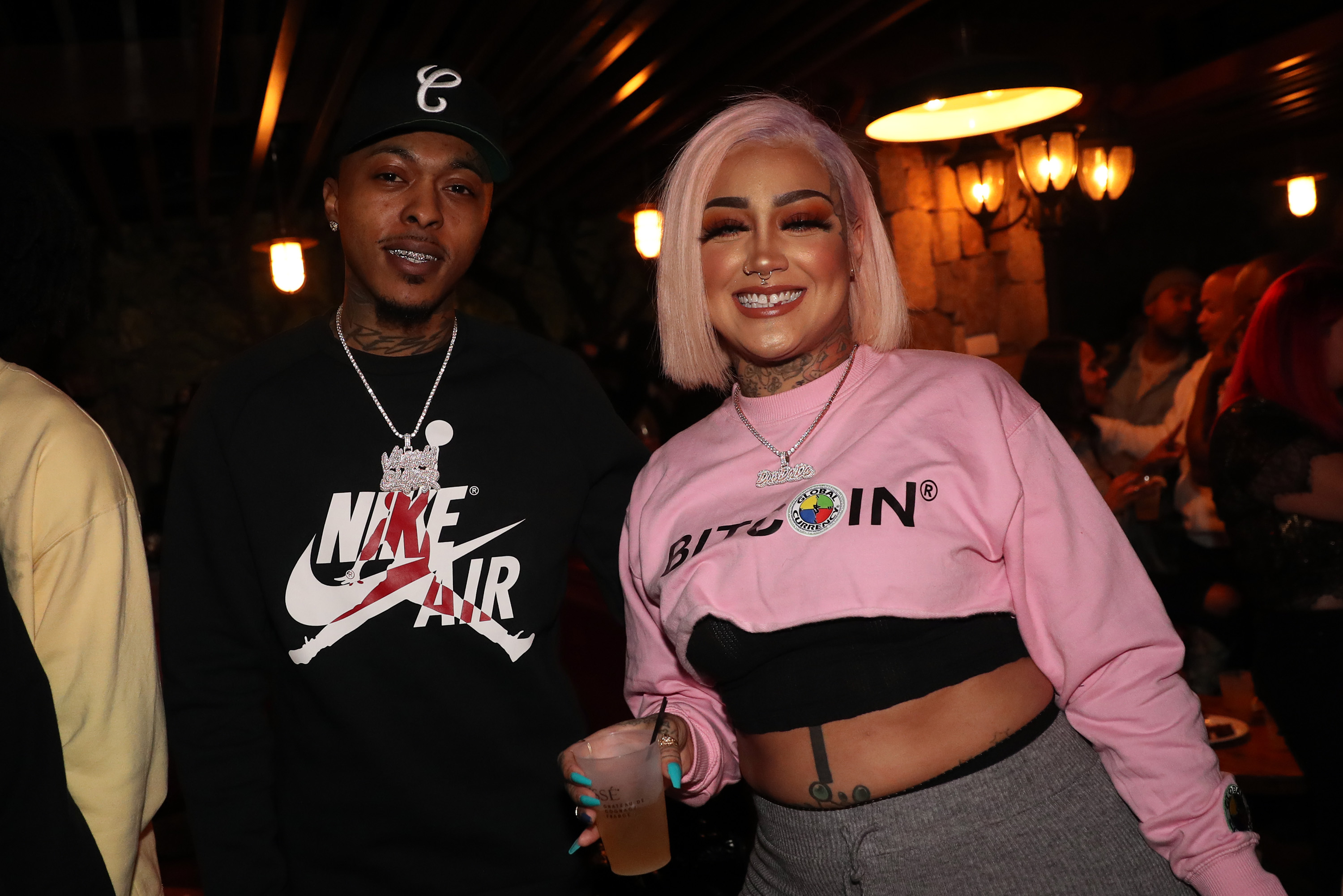 'Black Ink Crew' stars Alex Robinson and Donna Lombardi posing next to each other at Angela Yee's birthday party