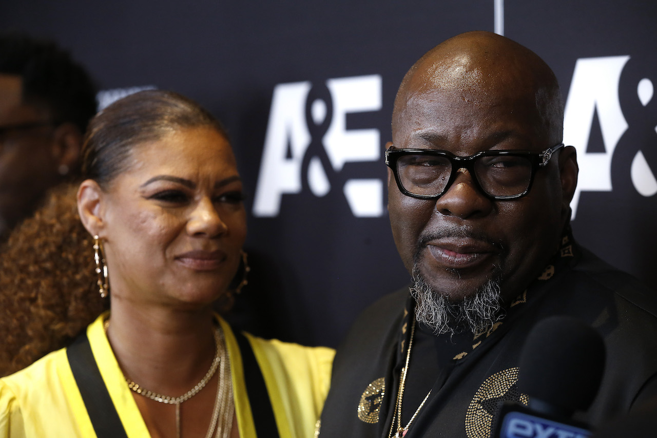 Bobby Brown and his wife Alicia Etheredge-Brown on the red carpet; Brown's wife is tired of the public talking about Brown's past marriage to Whitney Houston