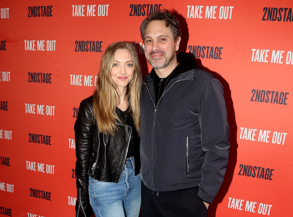 Amanda Seyfried and Thomas Sadoski pose at the opening night of Second Stage Theater's production of "Take Me Out" in 2022