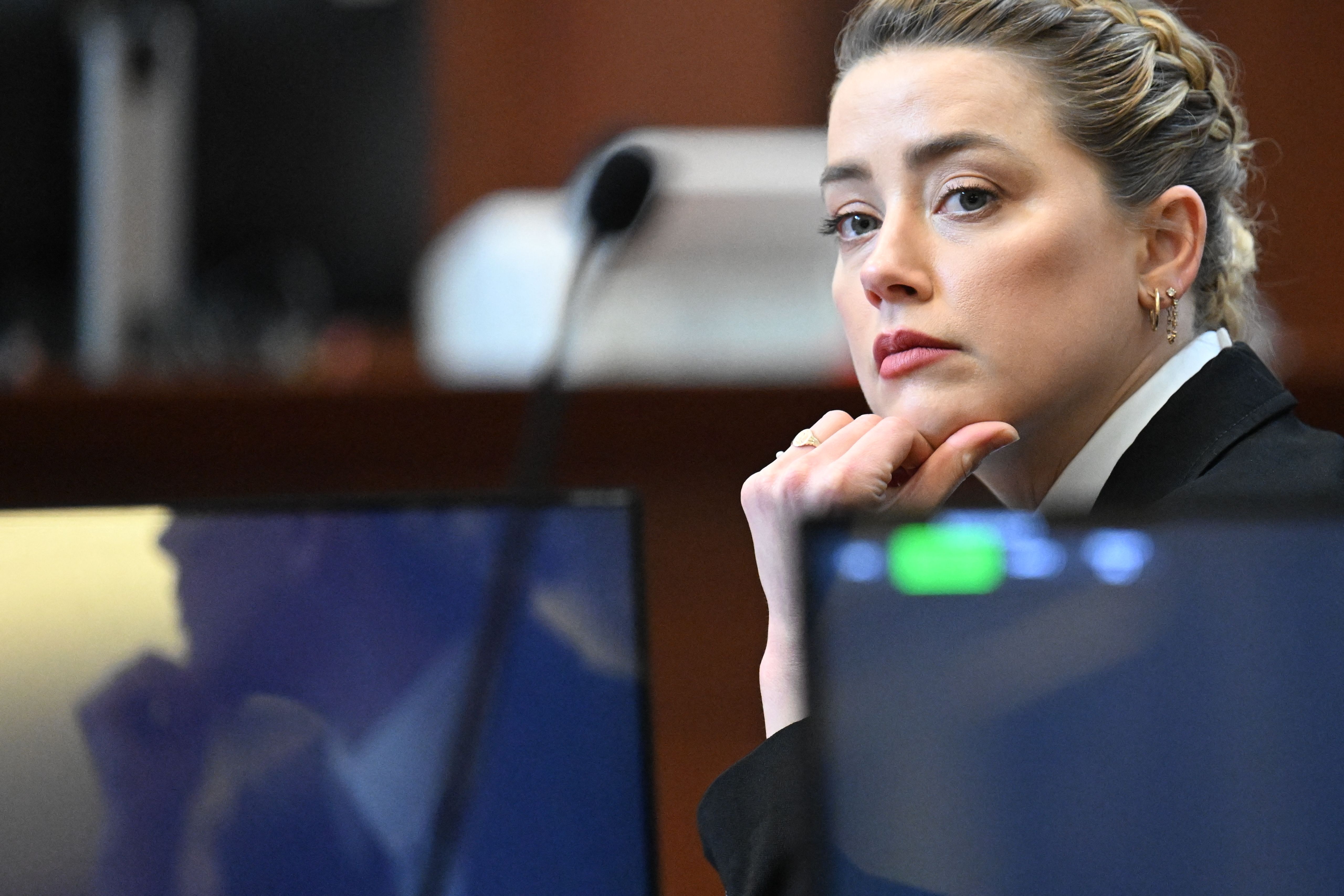 Actor Amber Heard looks on at her trial with ex-husband Johnny Depp