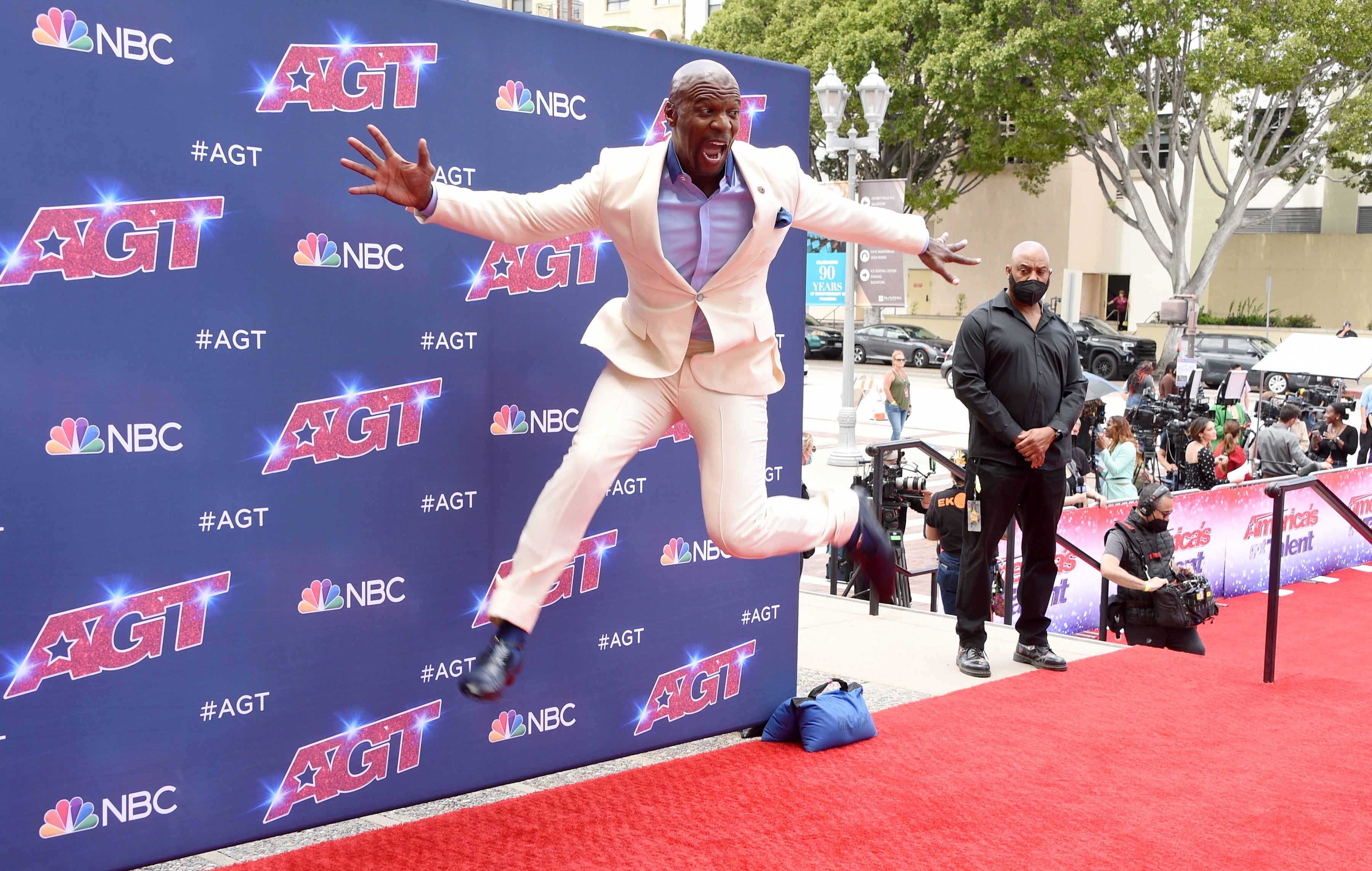 'America's Got Talent' host Terry Crews jumping in the air at the season 17 kick-off red carpet event