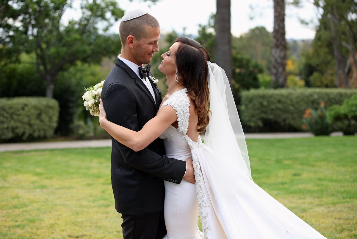 Ashley Hebert and J.P. Rosenbaum pose for photos after their wedding ceremony