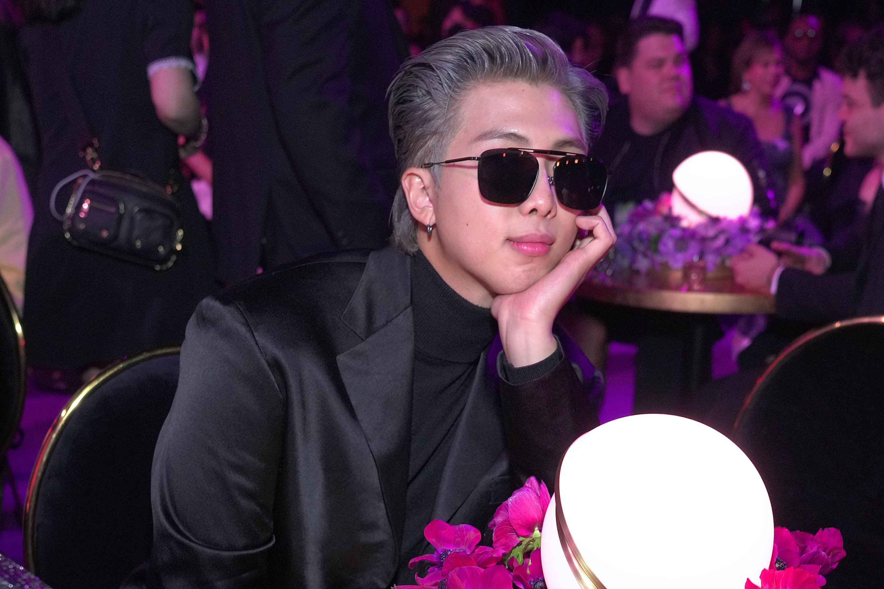RM of BTS wearing sunglasses at the 2022 Grammy Awards