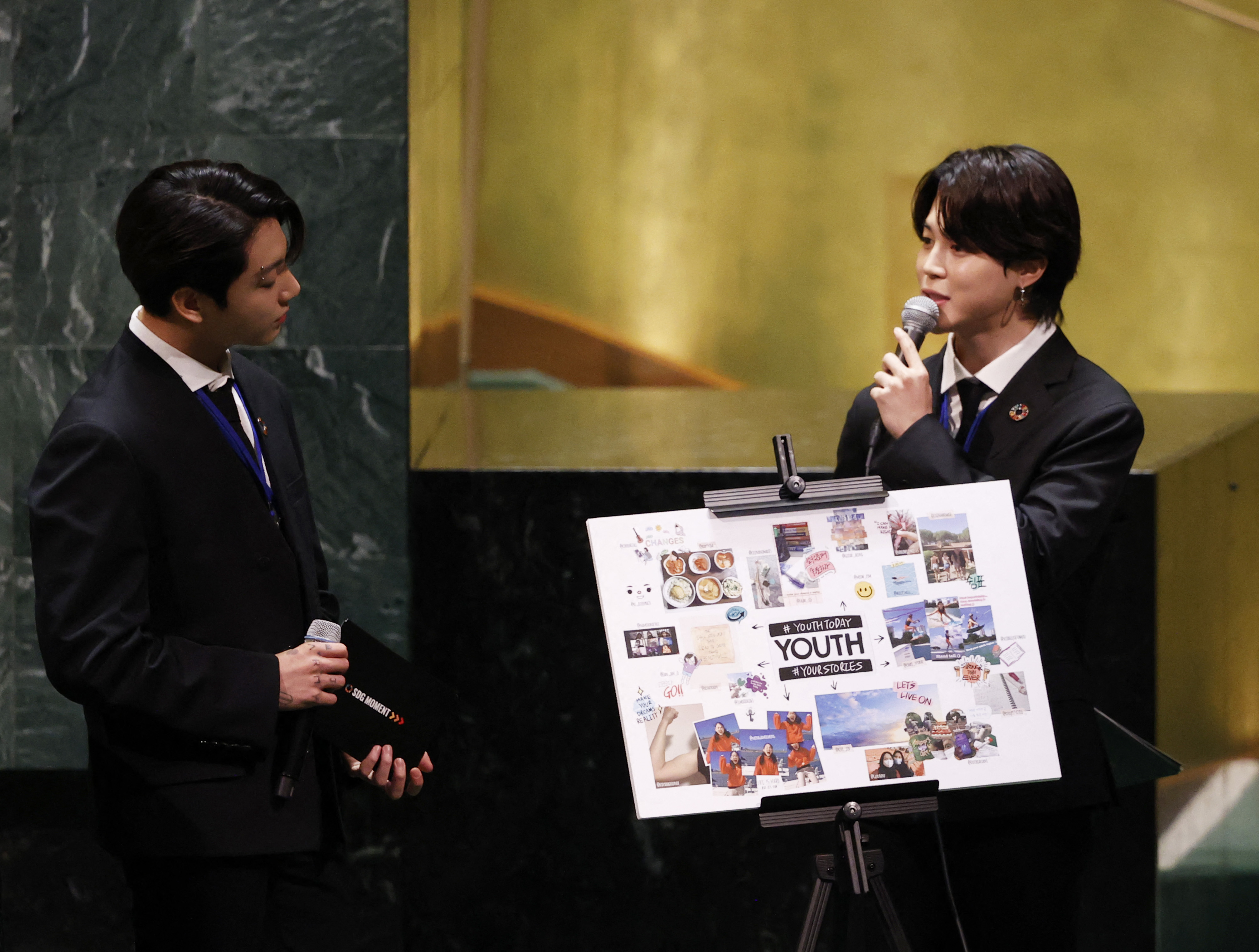 Jungkook listens as Jimin of the South Korean boy band BTS speaks at the UN General Assembly 76th session General Debate