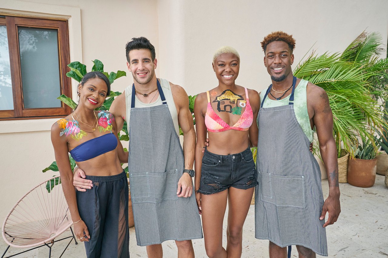 Natasha Parker, Ed Waisbrot, Chelsea Vaughn, and Demar Jackson pose together with paint on them in 'Bachelor in Paradise'.