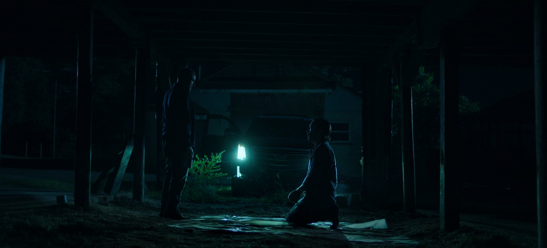 Nelson (Nelson Bonilla) holds a gun to Ben Davis' (Tom Pelphrey) head in the final season of 'Ozark'