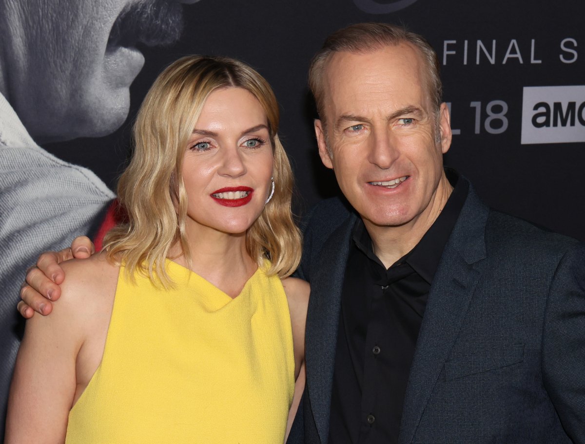 Rhea Seehorn and Bob Odenkirk attend the premiere of the sixth and final season of AMC's Better Call Saul. Seehorn wears a yellow dress and Odenkirk wears a grey suit. 