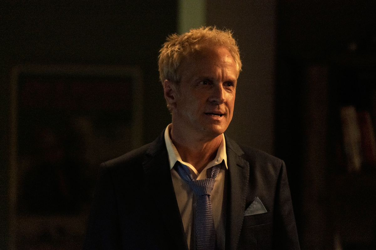 Patrick Fabian as Howard Hamlin in Better Call Saul Season 6. Howard wears a suit and loose tie and his hair looks disheveled. 