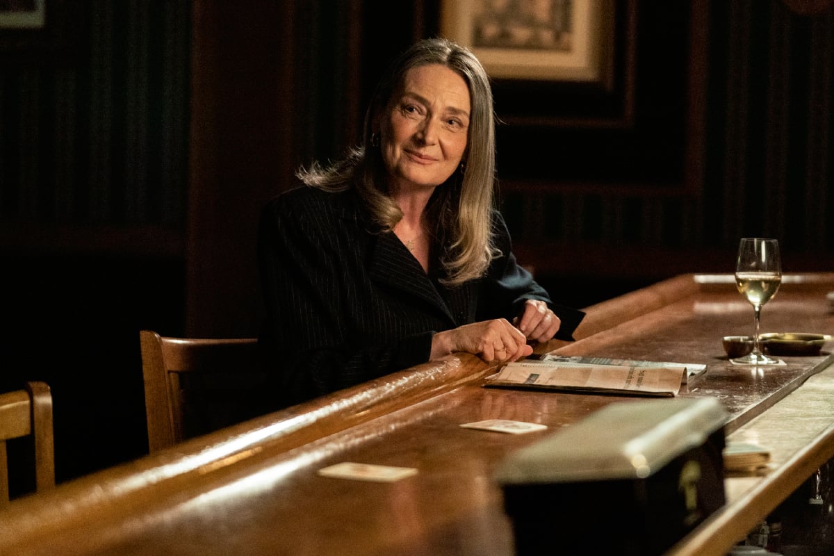 Andrea Sooch as Margarethe in Better Call Saul Season 6 Episode 5. Margarethe sits at a bar with a wine glass in front of her. 