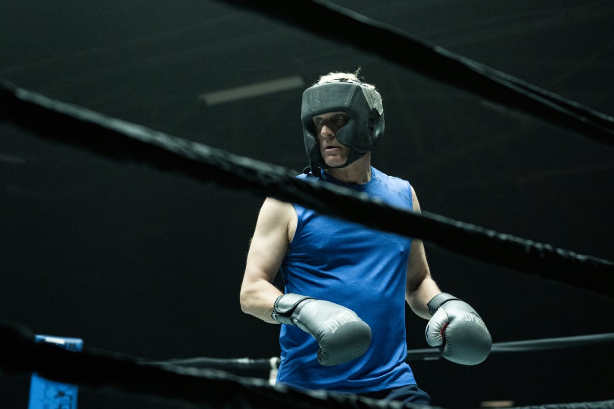 Patrick Fabian as Howard Hamlin in Better Call Saul Season 6. Howard wears boxing gear and stands in a boxing ring.  
