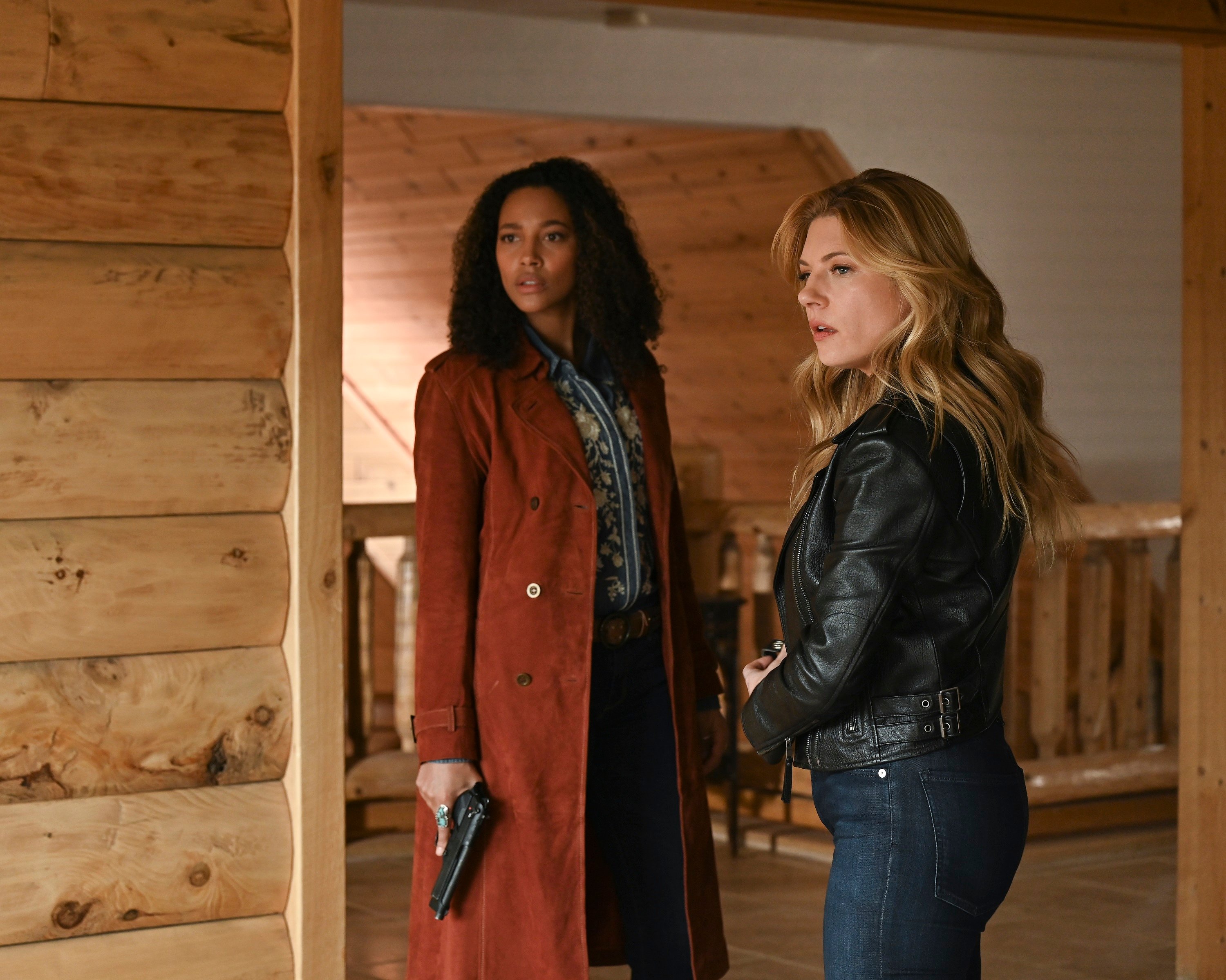 'Big Sky' cast Kylie Bunbury as Cassie and Katheryn Winnick as Jenny standing together with guns out