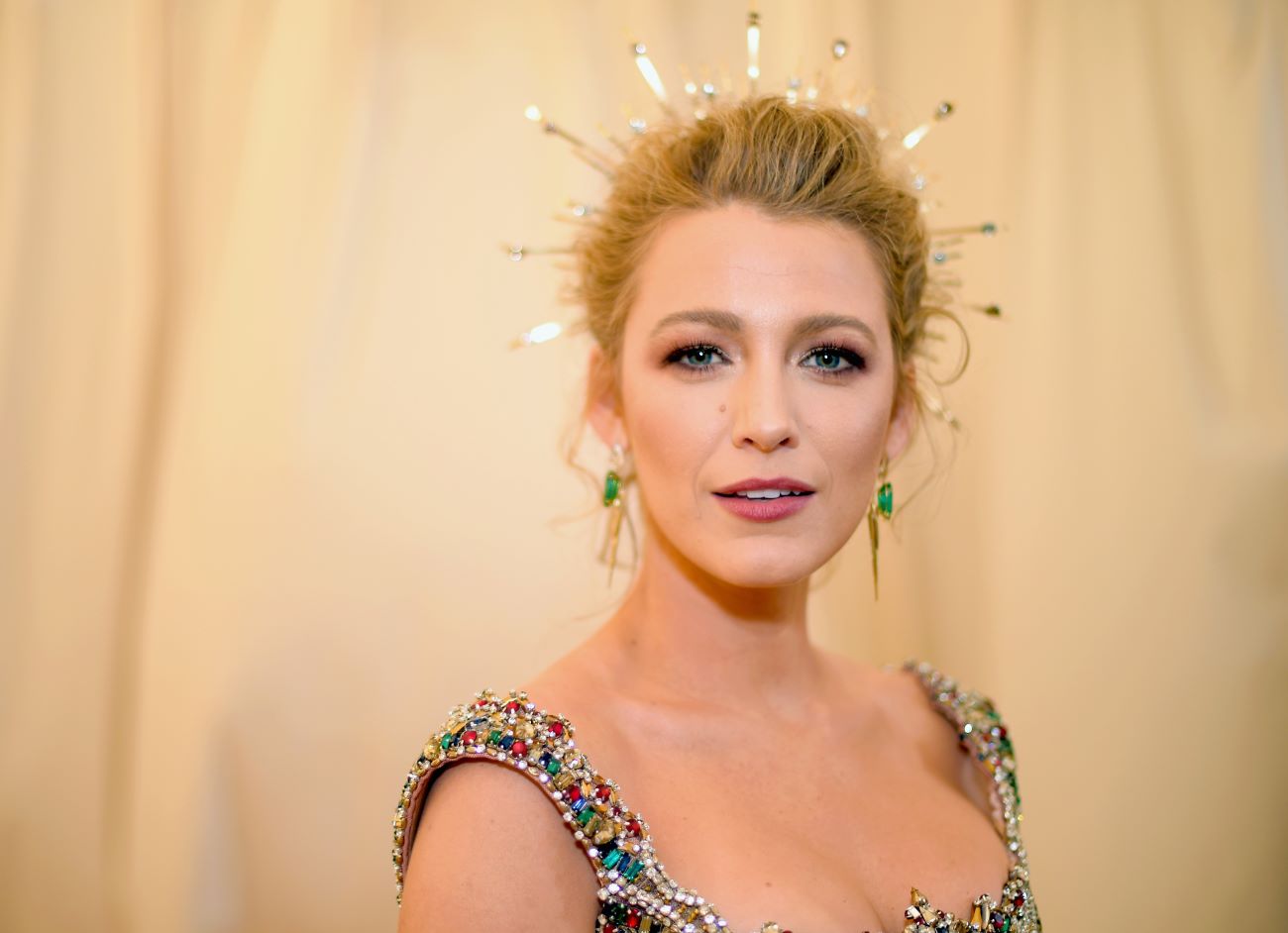 Blake Lively wears a sunbeam crown and bejeweled outfit at the 2018 Met Gala.