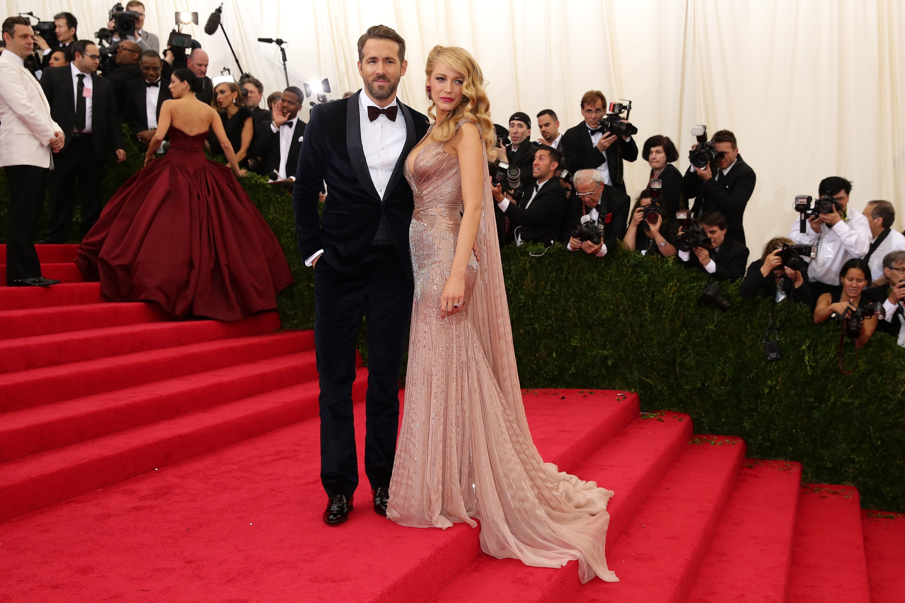 Blake Lively and Ryan Reynolds pose at the Met Gala in 2014