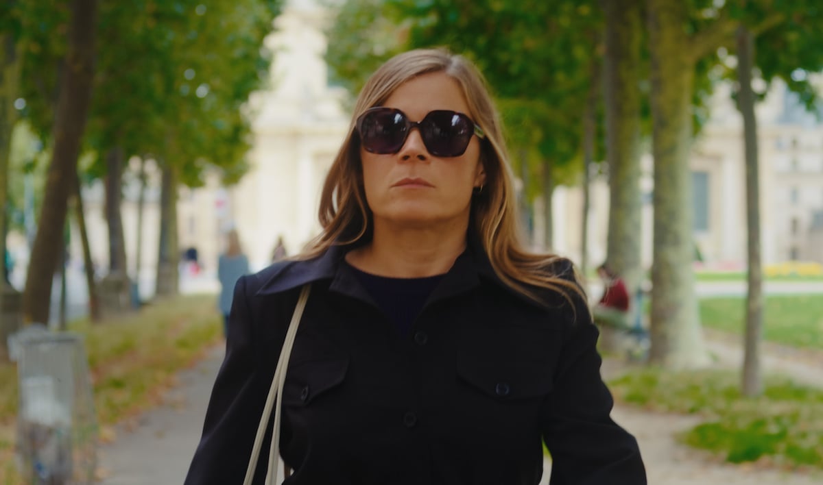 Blanche Gardin as Jeanne Mayar wearing all black and dark sunglasses in 'Everybody Loves Jeanne'