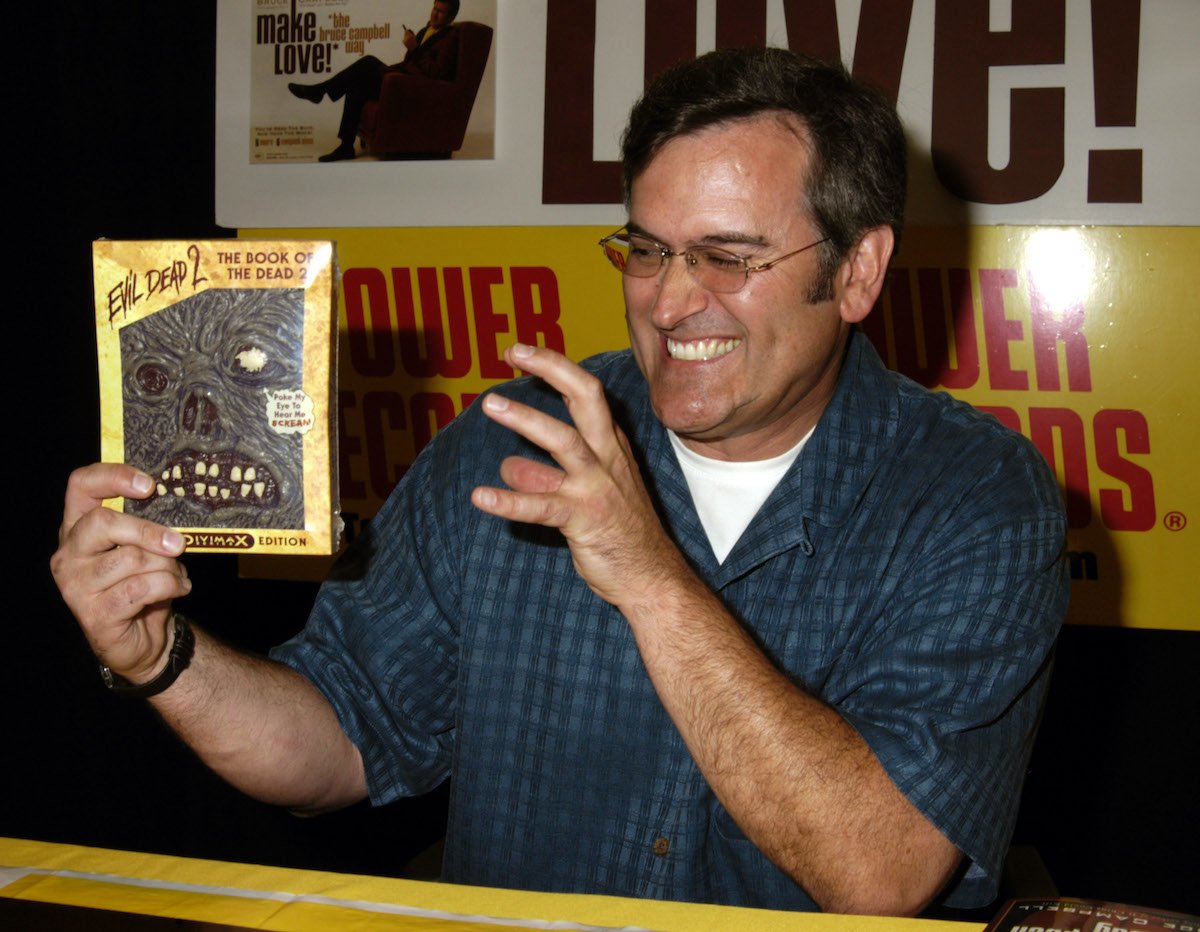 Bruce Campbell holds the ‘The Evil Dead 2’ (Book of the Dead Limited Edition) DVD