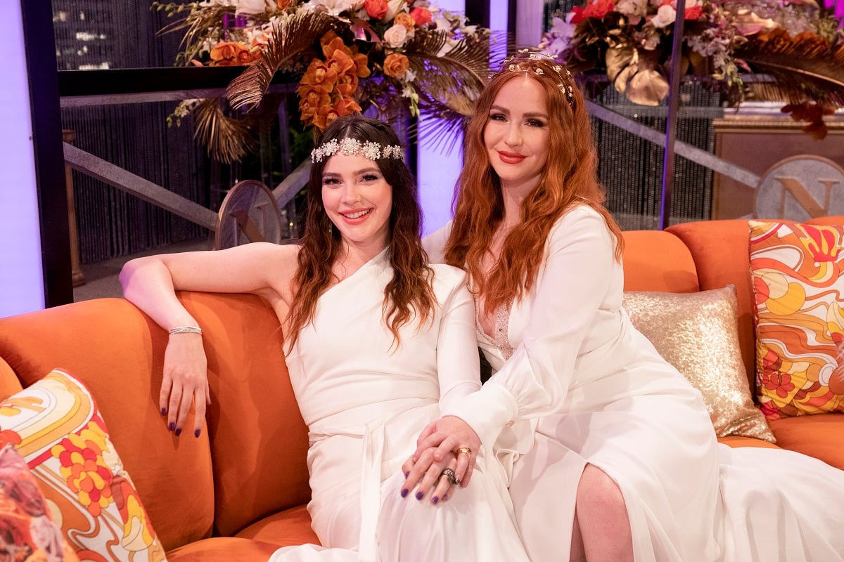'The Young and the Restless' stars Cait Fairbanks and Camryn Grimes wearing white wedding dresses.