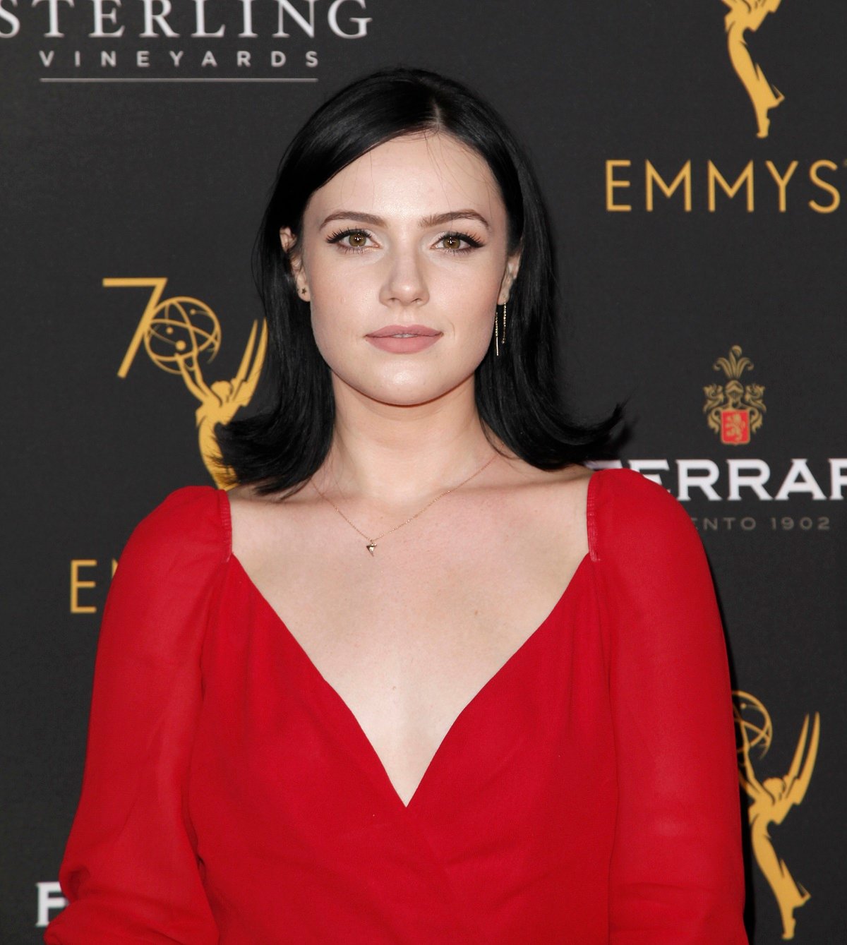 'The Young and the Restless' actor Cait Fairbanks wearing a red dress during the Daytime Emmys.