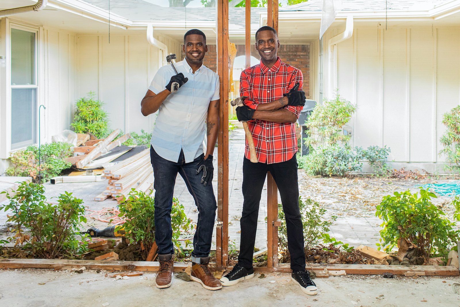 Chris and Calvin LaMont in the living room of the Campbell home, as seen on HGTV's Buy It Or Build It.