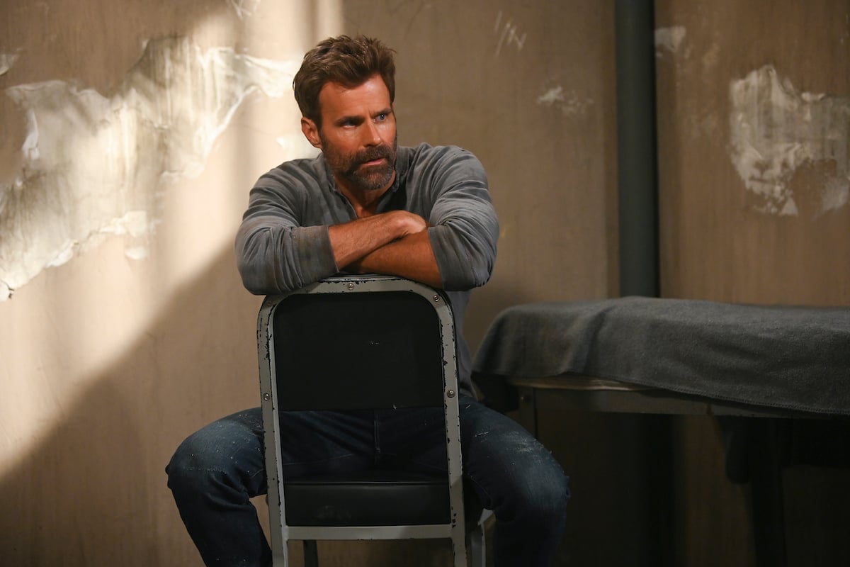 Cameron Mathison sitting in a chair