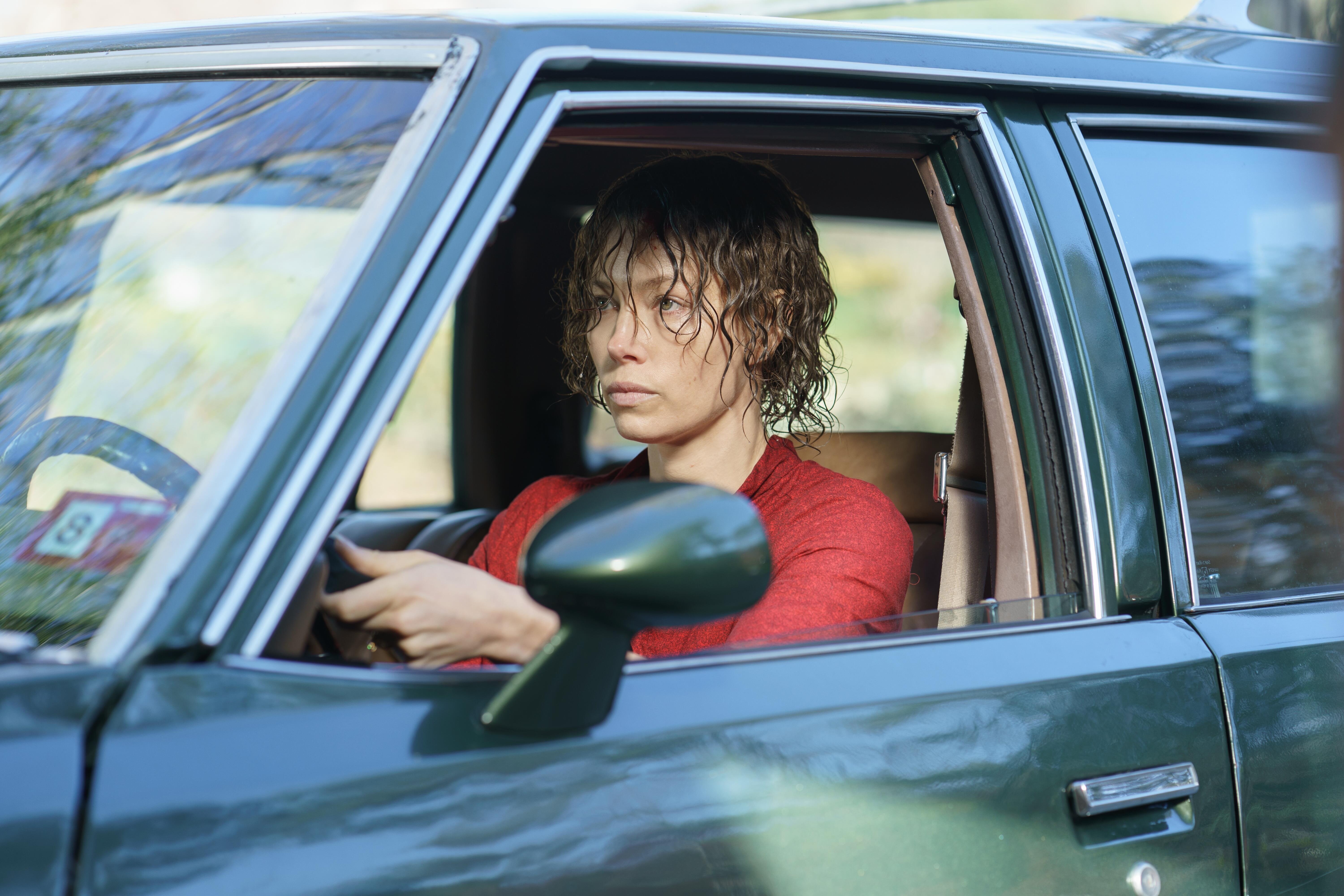 Jessica Biel drives a station wagon with wet hair as Candy Montgomery in Hulu's 'Candy'