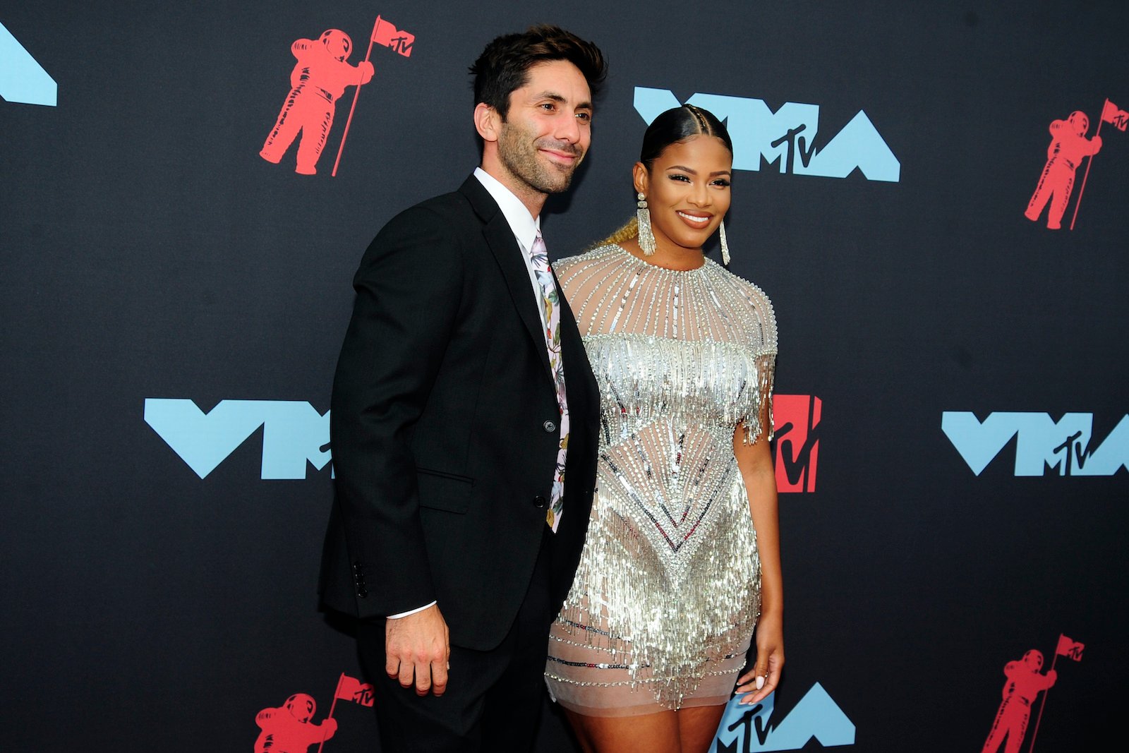 Nev Schulman and Kamie Crawford, hosts of 'Catfish: The TV Show' attended an awards show in 2019 and smiled for cameras