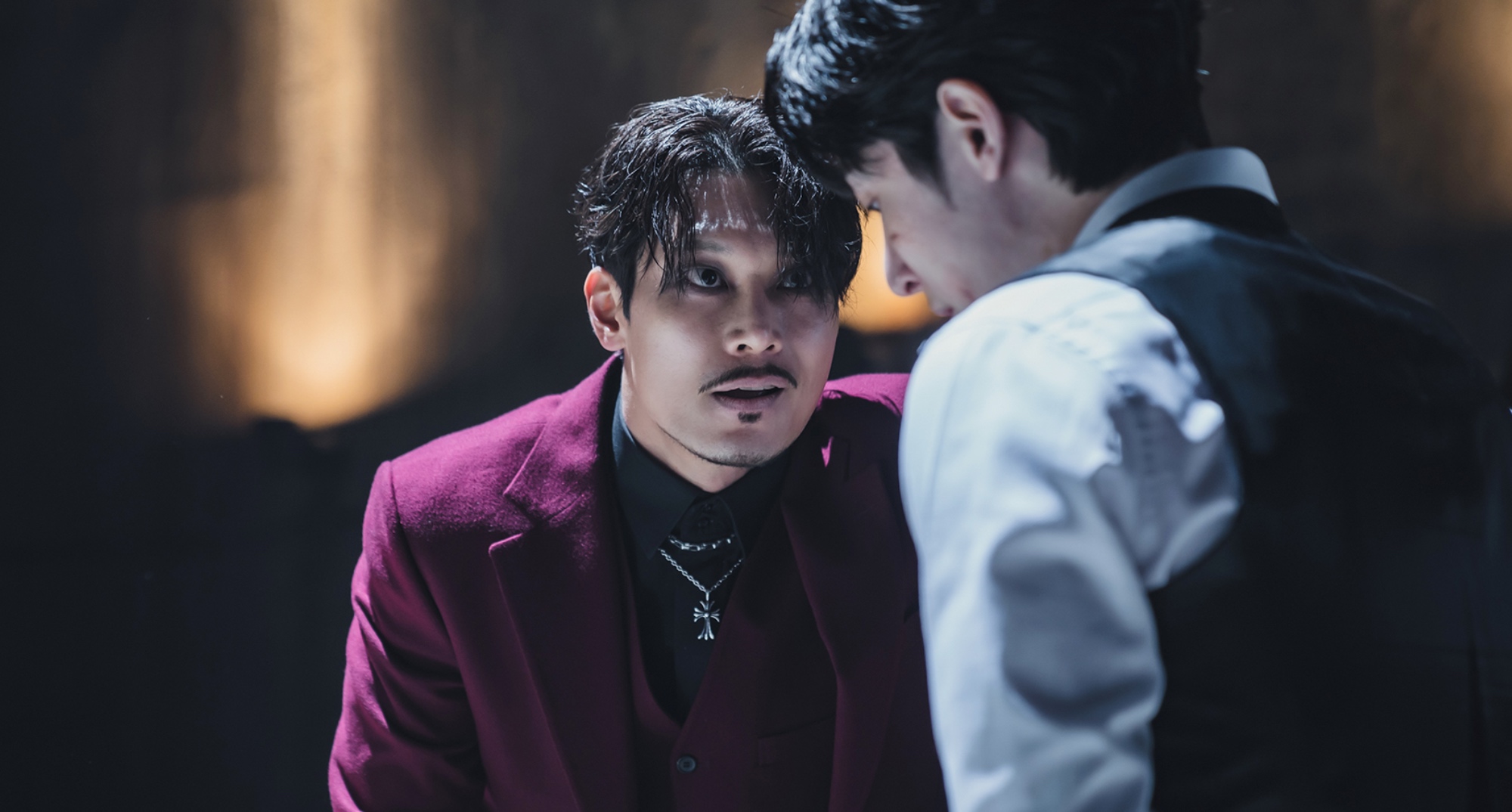 Character Mr. Ha from 'Tomorrow' Episode 16 K-drama wearing red and black suit.