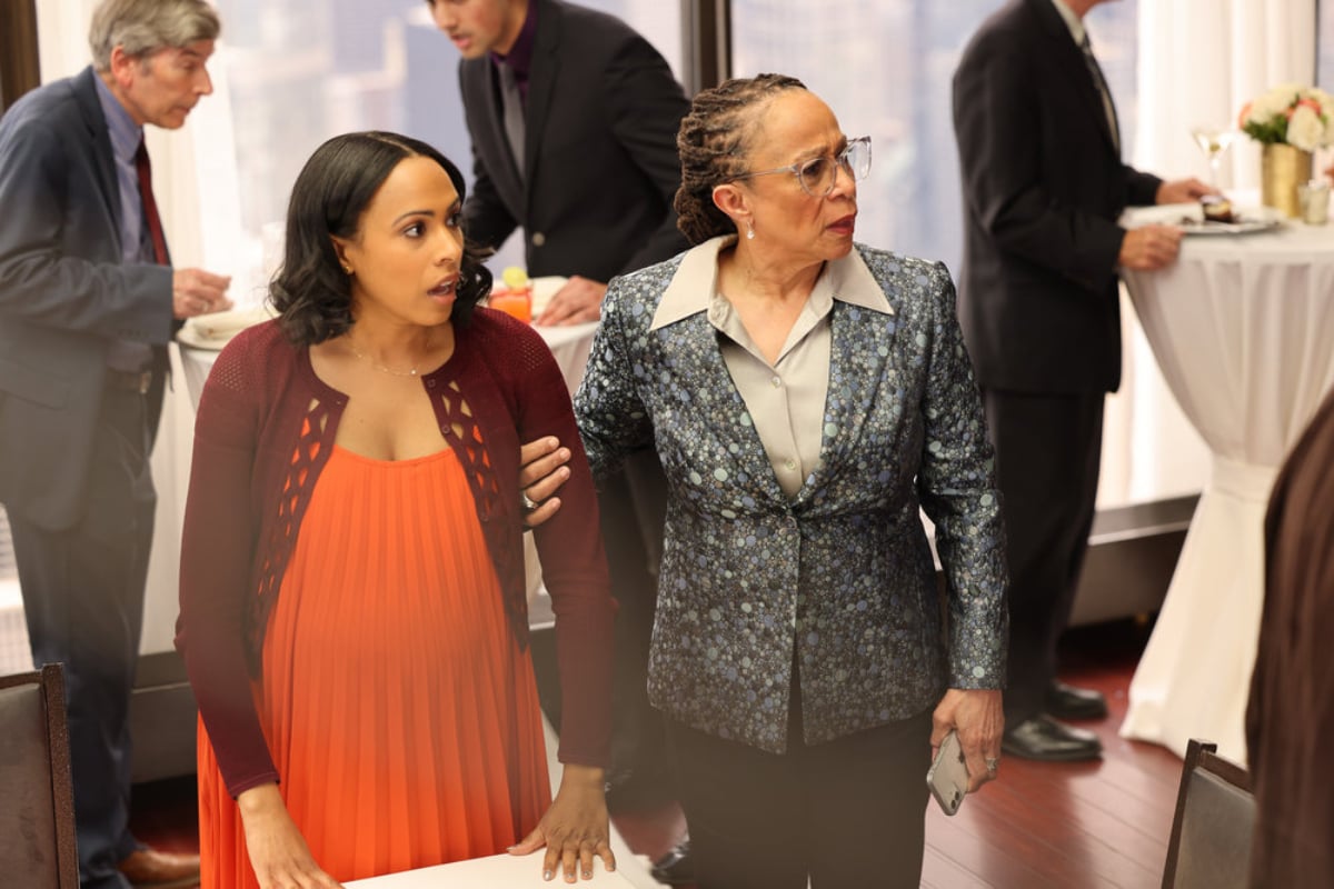 Tara Goodwin and Sharon Goodwin in Chicago Med Season 7 Episode 22. The are at a fancy party and they both look startled. 