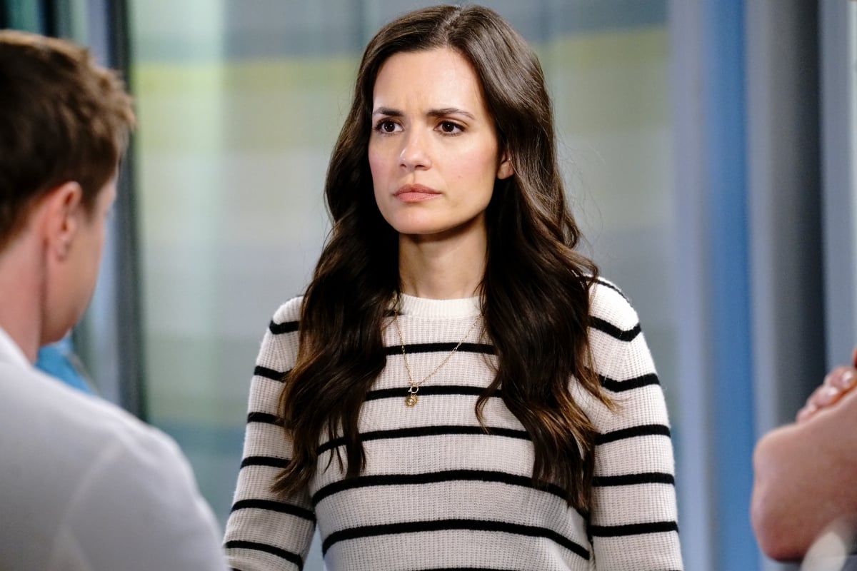 Torrey DeVitto as Natalie Manning in Chicago Med. Natalie wears a black-and-white striped shirt. 