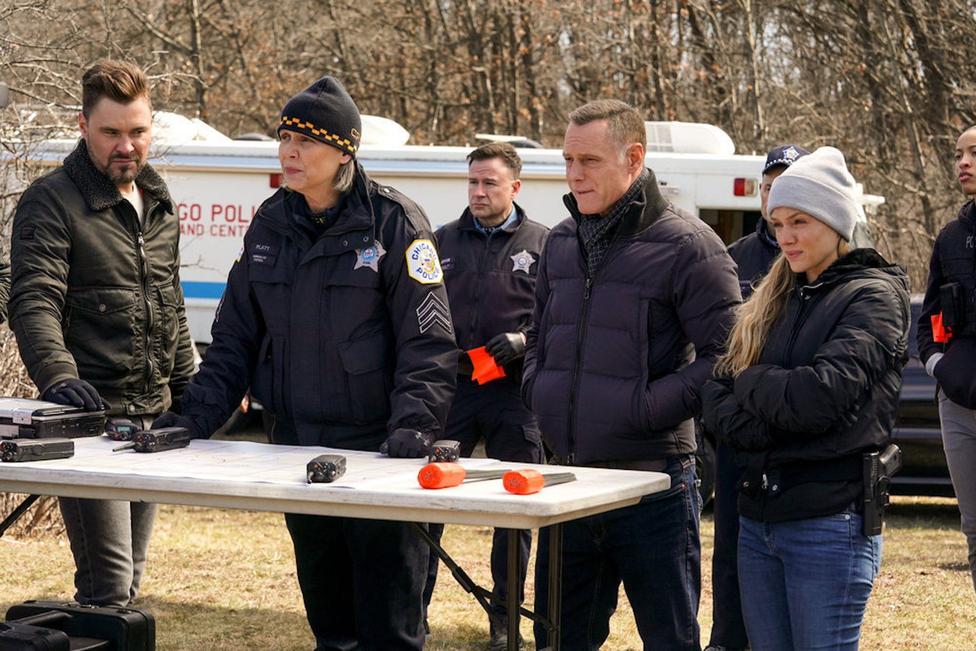 Trudy Platt, Hank Voight, Hailey Upton, and Adam Ruzek outside of a crime scene in 'Chicago P.D.' Season 9 Episode 20