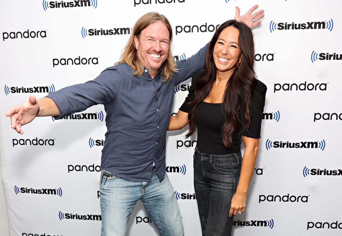 Chip and Joanna Gaines smile and pose together at an event.