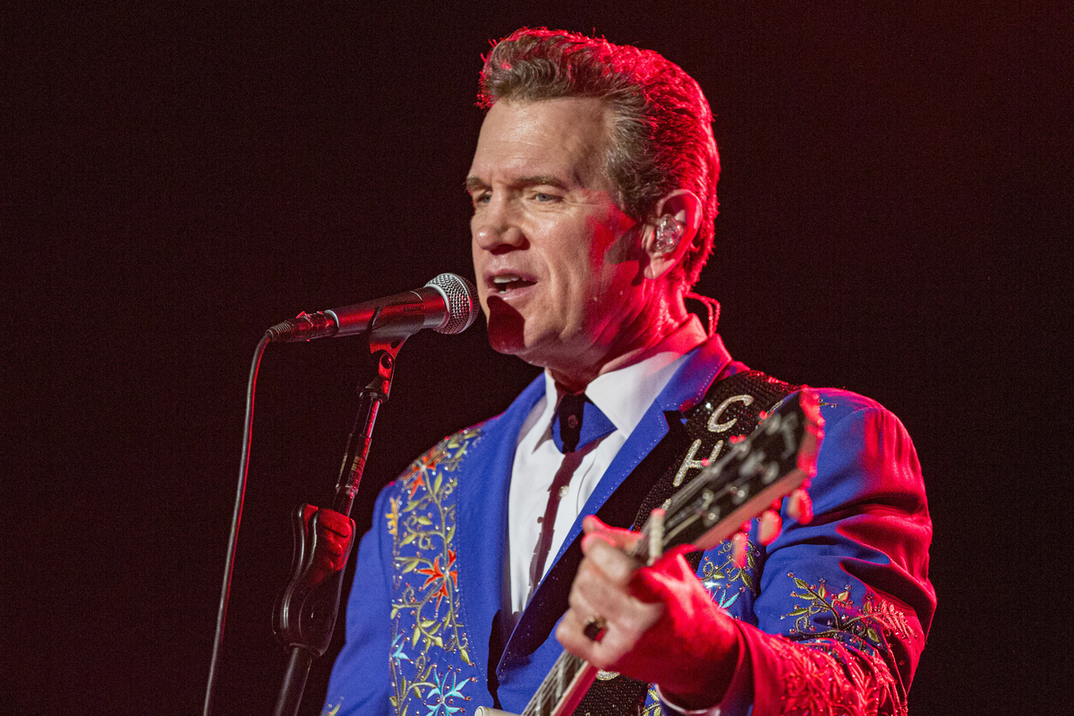 Chris Isaak, who covered 'Can't Help Falling in Love,' performs on stage in Temecula, CA. 