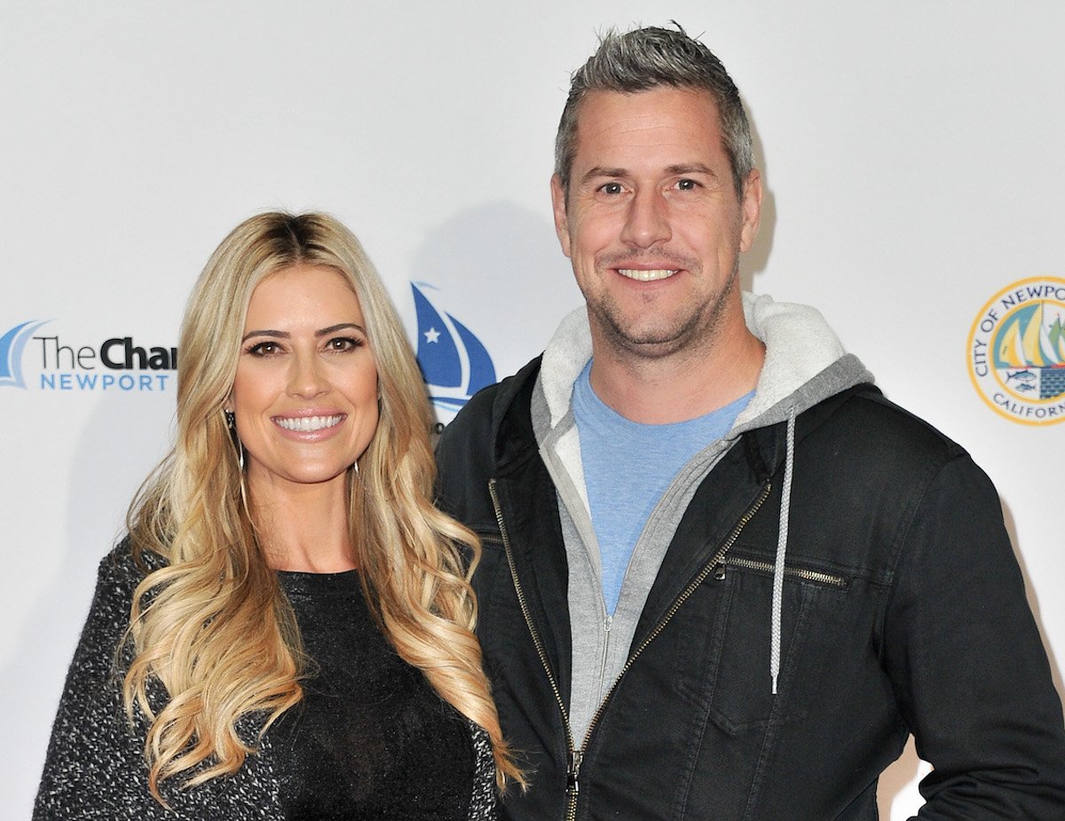 Christina Haack and Ant Anstead, who responded to an Instagram comment about taking Hudson 'away' from Christina Haack, stand next to each other and smile