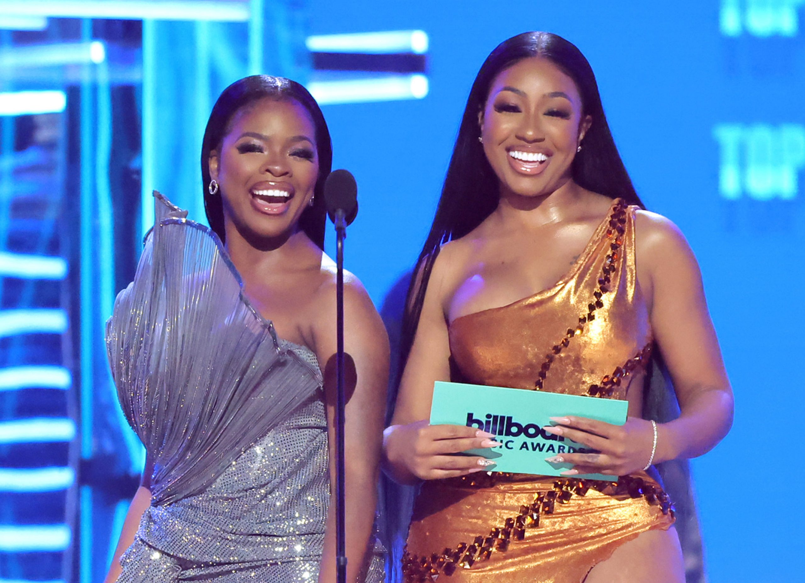 JT and Yung Miami of City Girls speak onstage during the 2022 Billboard Music Awards