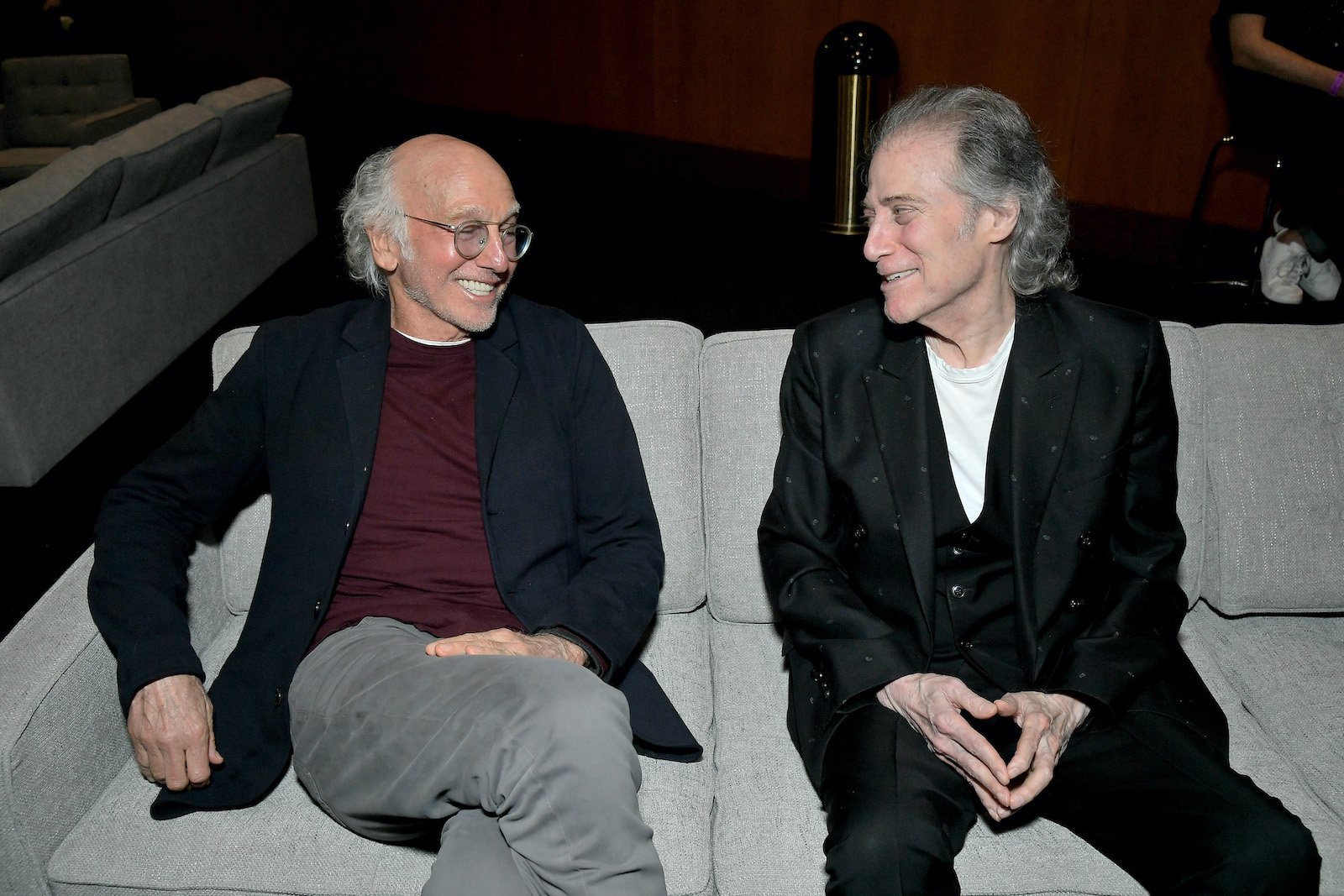 Larry David and Richard Lewis sit next to each other and smile at the Curb Your Enthusiasm FYC Panel 