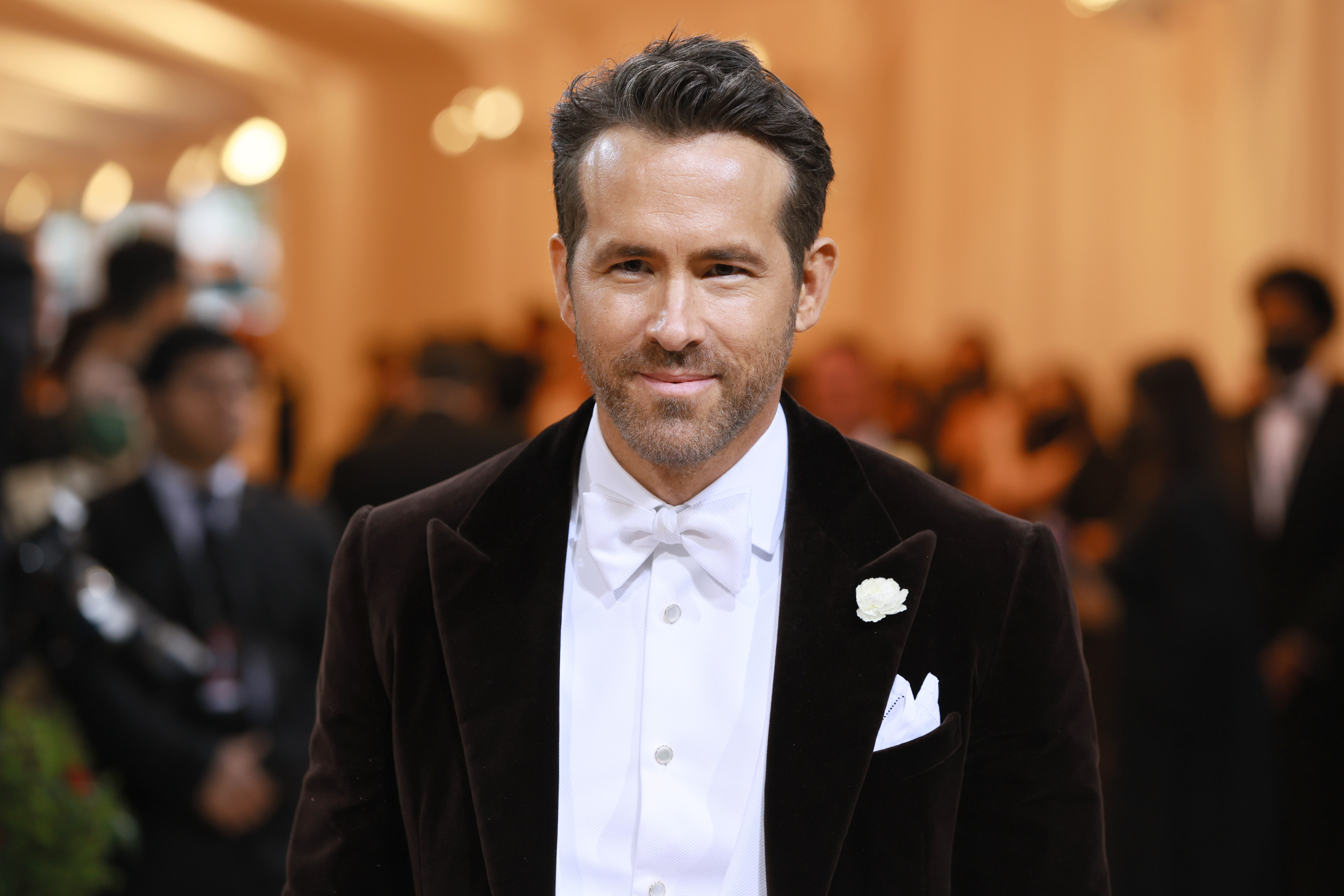 Ryan Reynolds, who many believed would show up in 'Doctor Strange 2' as Deadpool, wears a black velvet suit over a white button-up shirt and white bow tie.